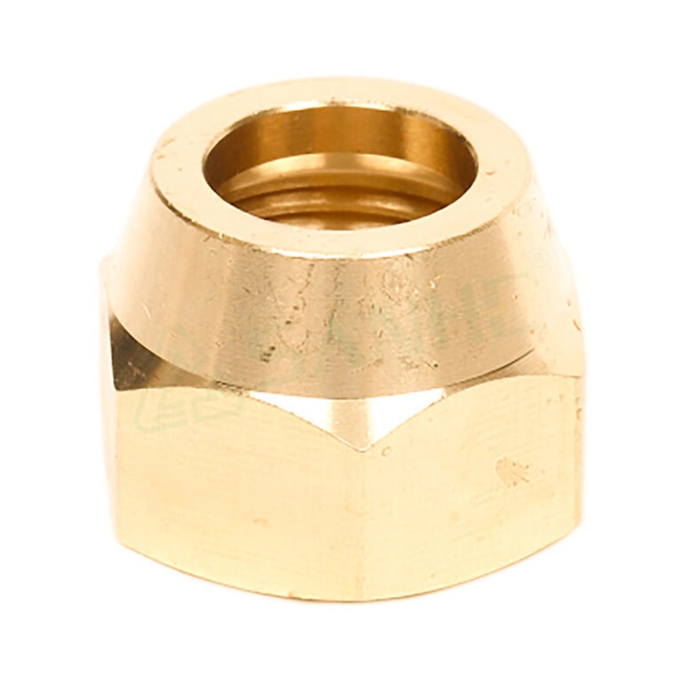 Close-up of a brass nut fitting used in plumbing and HVAC systems, showcasing its threaded interior and metallic finish.